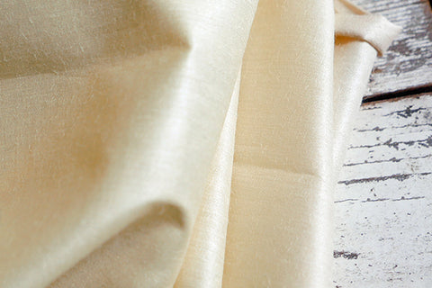 Cream coloured flat silk fabric