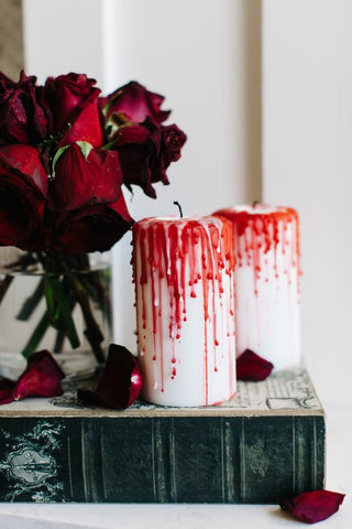 Blood Red Wa dripping on white candles