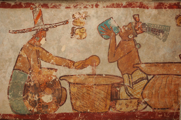 Painting from the ancient Maya city of Calakmul depicting the preparation and drinking of cacao. Photo by Kenneth Garret, Nat Geo image collection.