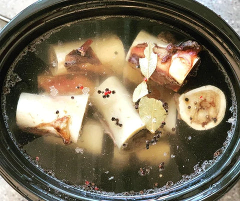 bone broth with bones in a pot