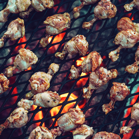 Chicken drumsticks on an open fire 