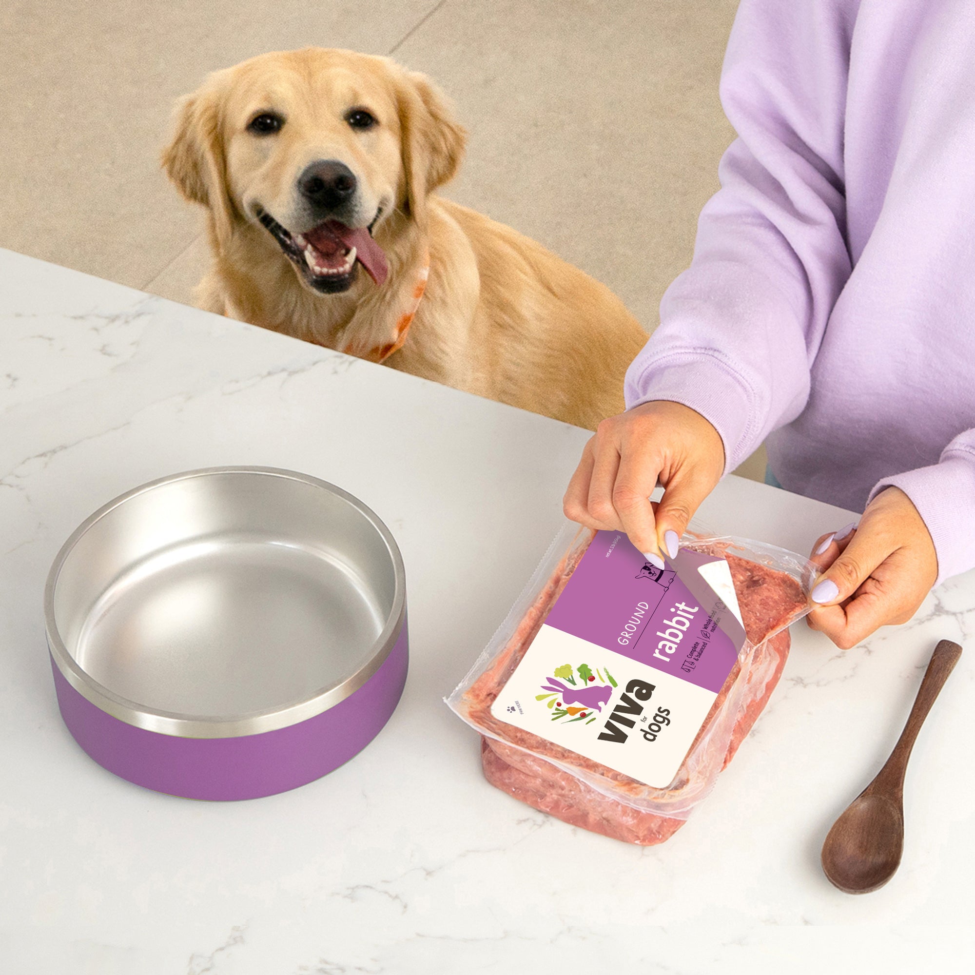 Golden Retriever happily waits for Viva meal