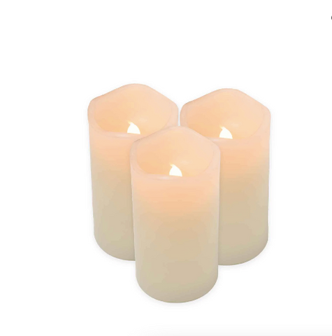 3 white pillar candles