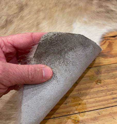 fix cowhide rug curl