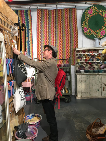 Man looking at merchandise in shop