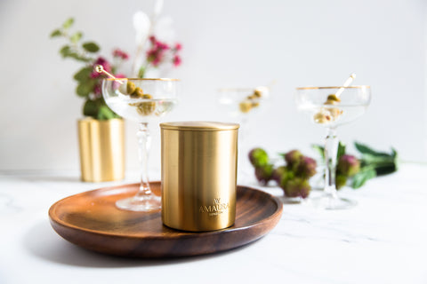 Gold eco-luxury candle and gin cocktails