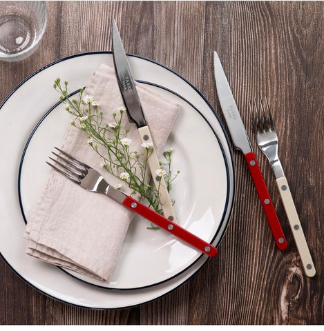 Red Sabre Bistrot cutlery on white plate