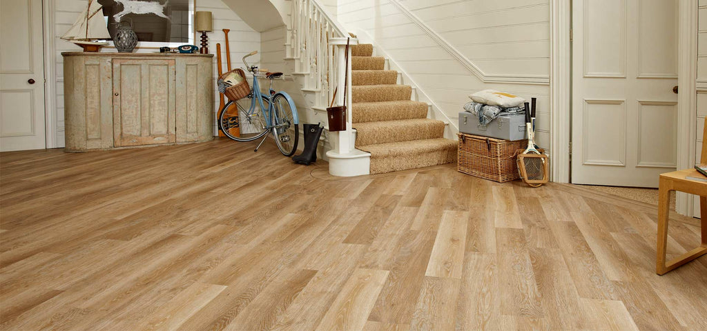 Laminate flooring installed in a high-traffic hallway, showcasing its durability and resistance to wear