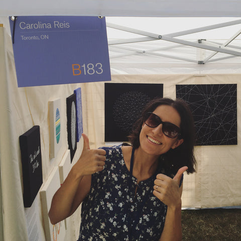 carolina in their booth at the toronto outdoor art fair july 2022