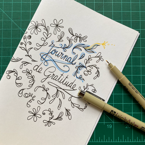 Exemple of the printable gratitude journal with two colouring pens