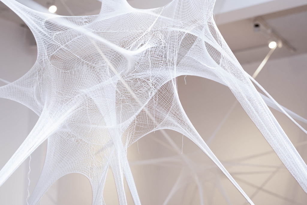 Detail of textile installation showing fine knitted thread 3D sculpture