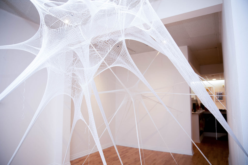 Detail of installation showing 3D sculpture made of fine knitted thread