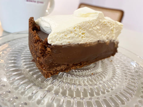 chocolate tart topped with whipped cream