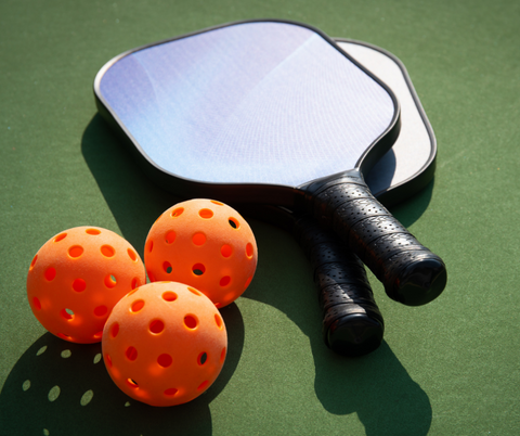 Pickball paddles and balls 