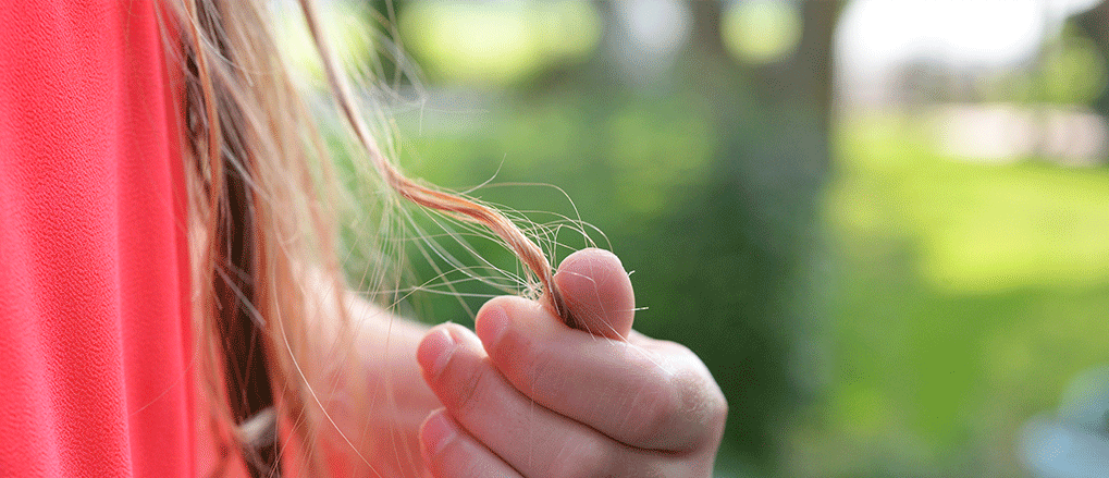 What causes postpartum hair loss?