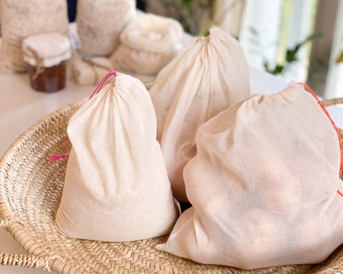 Produce bags full of fresh ingredients.