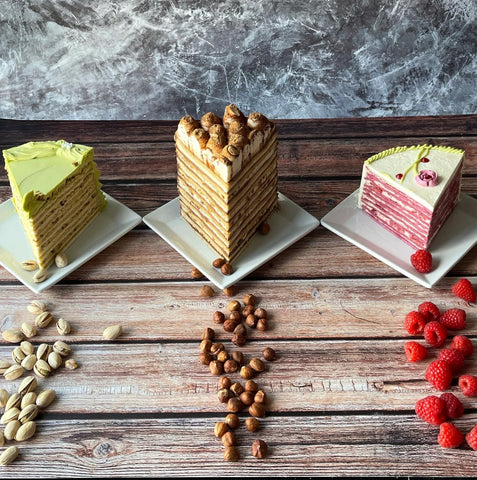 Tasty cakes with many layers - pistachio, tiramissu, raspberry honey cakes