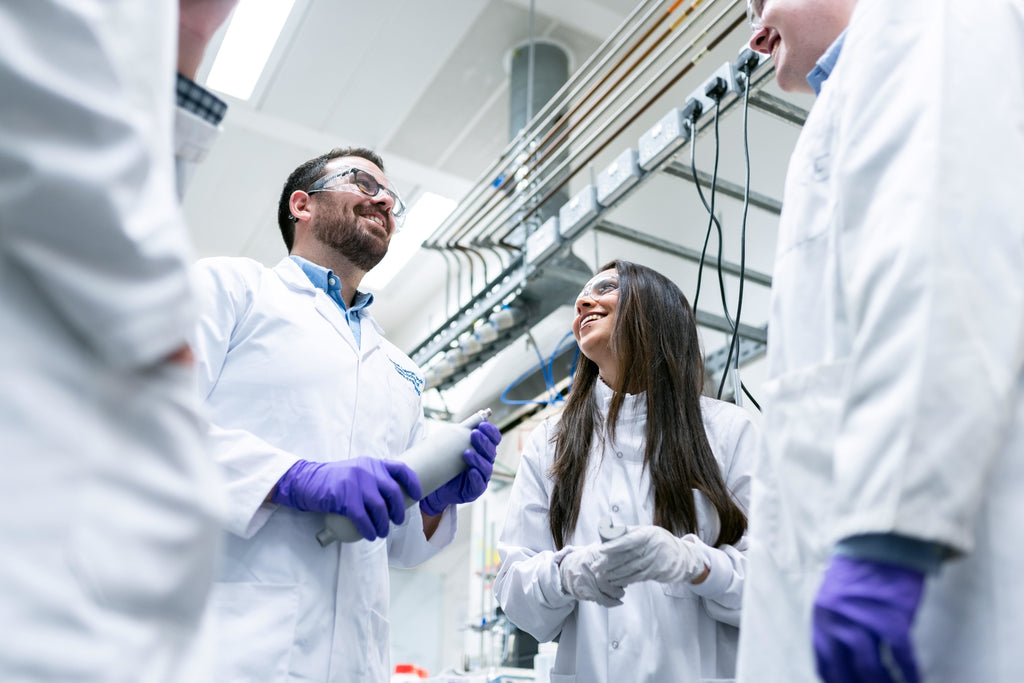 Image of scientists protected by their lab coats