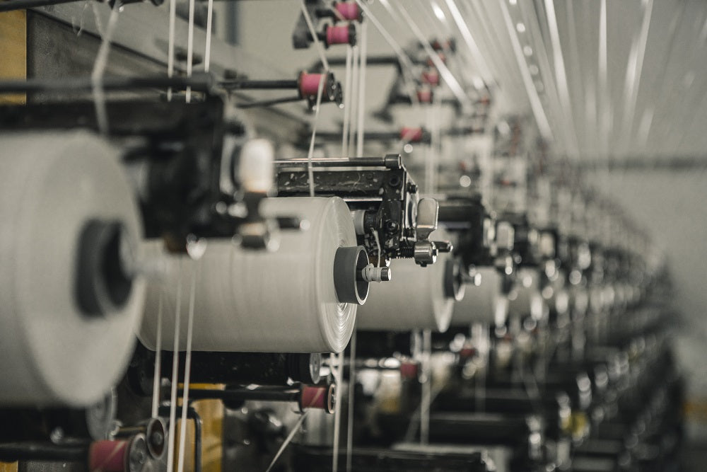 spools of thread in a factory