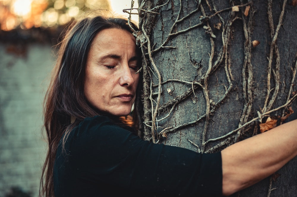 woman hugging a tree