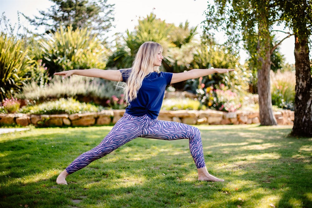 young woman in warrior yoga pose I