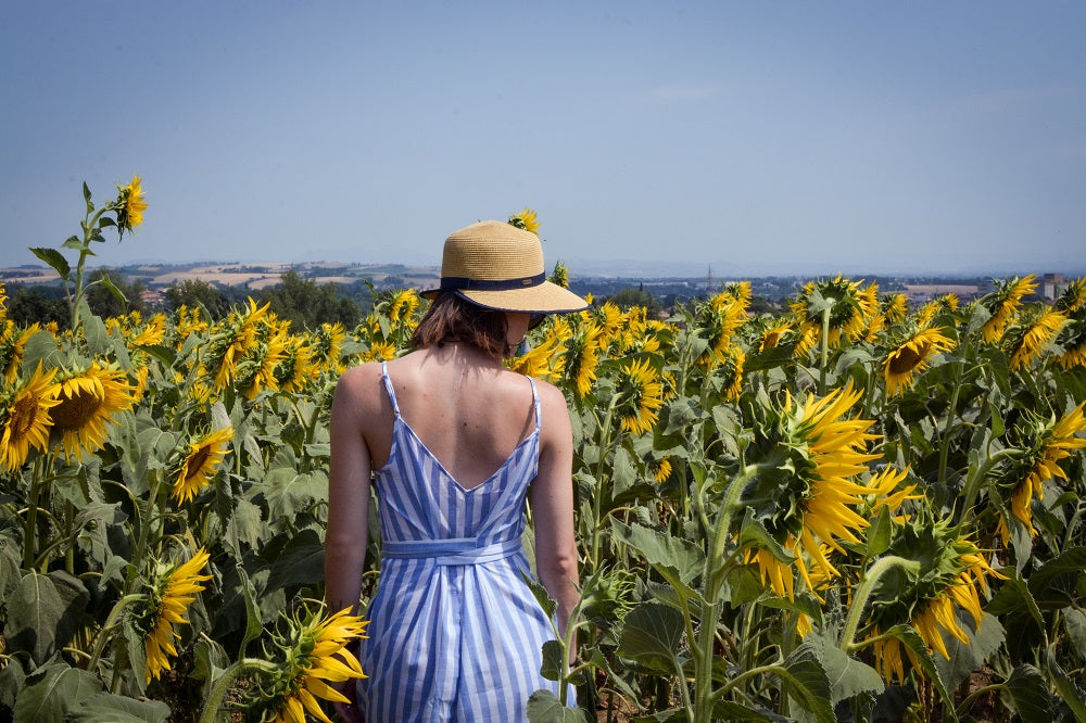 young woman in a field of sunflowers