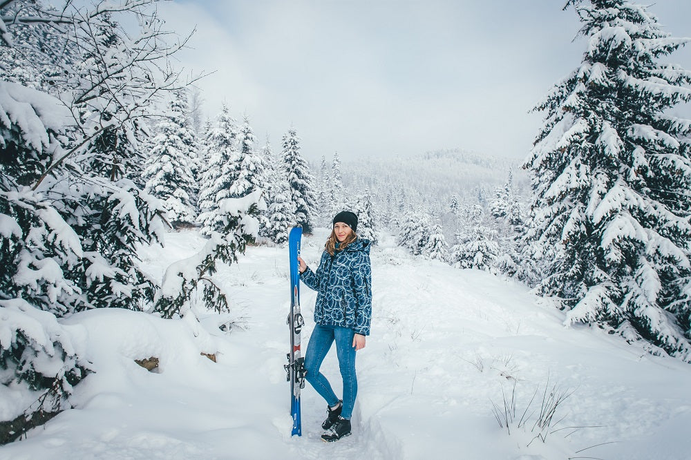 young woman in ski outfit