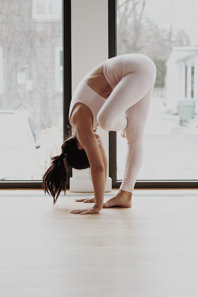 young woman in white yoga outfit