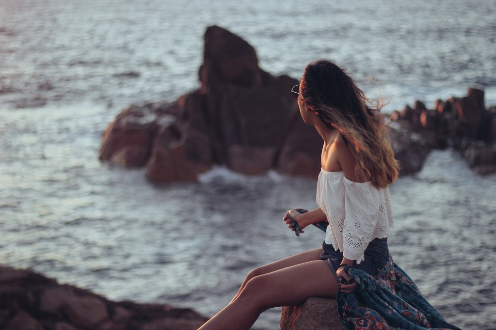 young woman contemplating the sea