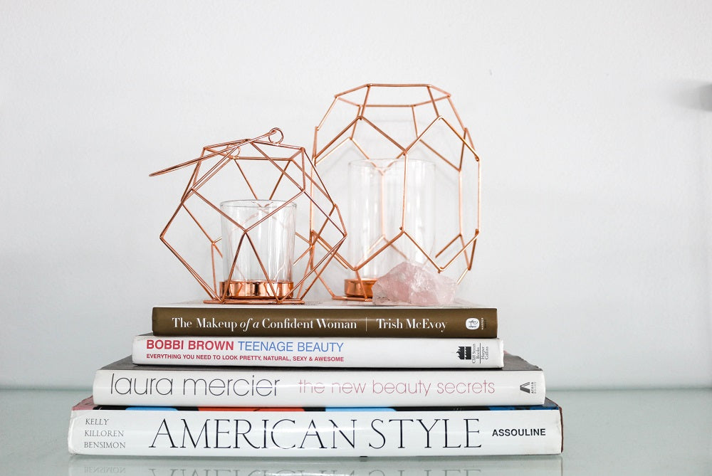 stack of books with candles