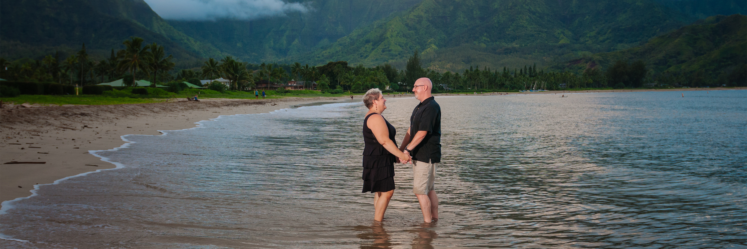 Cherie and her husband on a beach in Kauai