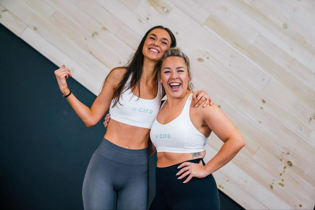 Two happy women wearing Cira gym clothes