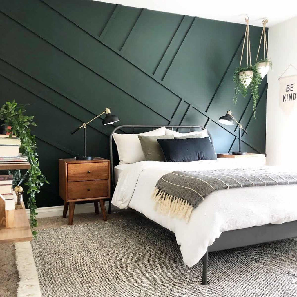 bedroom with forest green accent walls