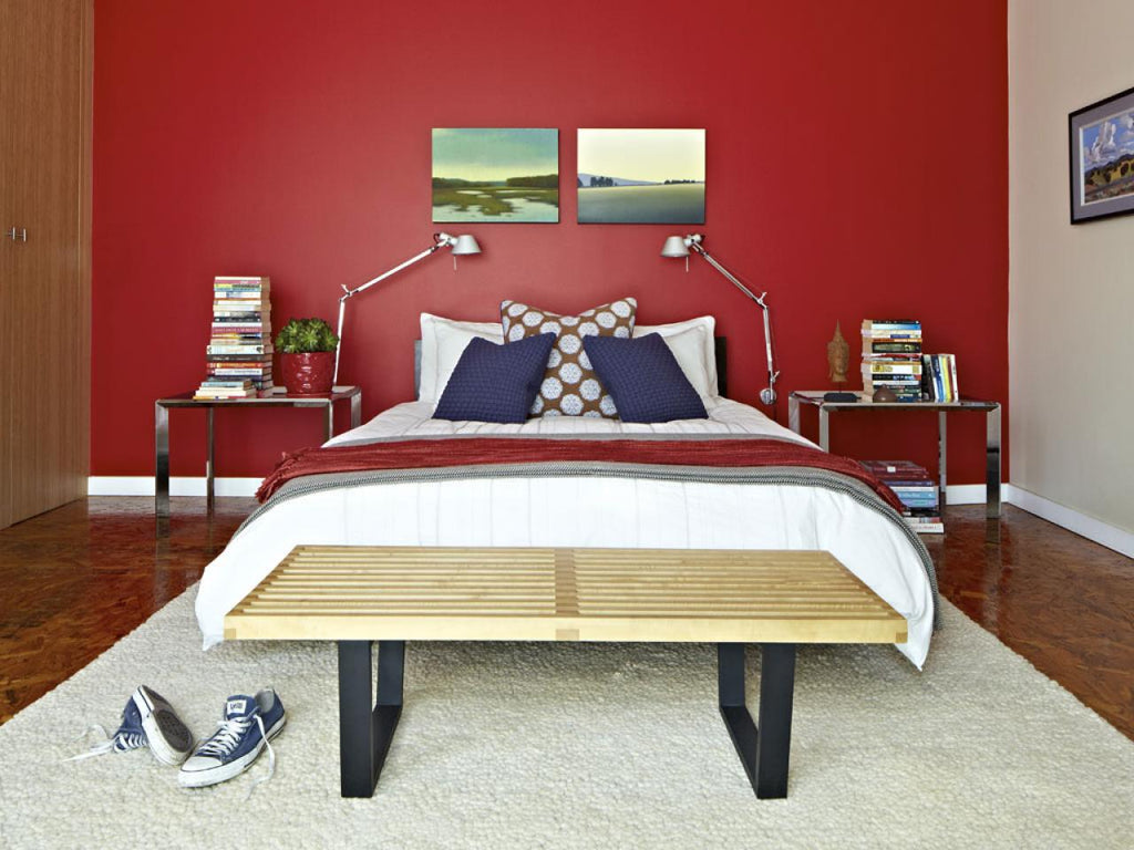 bedroom with red accent wall