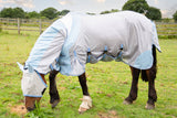 Serene horse draped in a protective mask and sheet, undisturbed by flies, peacefully grazing on a bed of hay, embodying tranquility and contentment amidst nature.