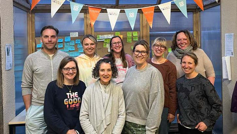 A group photo of staff and volunteers at The Village