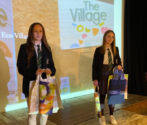Two Robert Smyth Academy students with the tote bags they designed and created