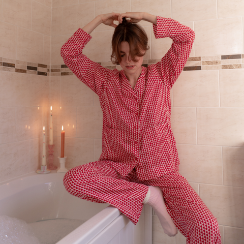 running a bubble bath in red hounds of love pyjamas
