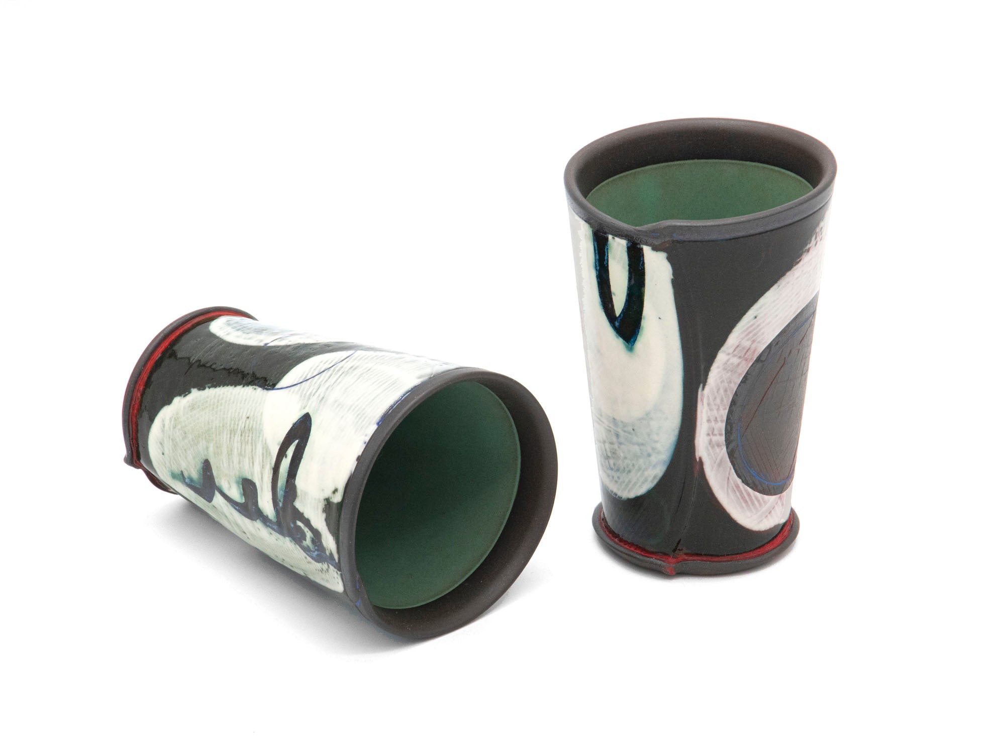 Cups,  Hand-built stoneware with underglaze decoration, oxidation fired  