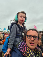 Minimeis Shoulder Carrier at Glastonbury with a 4 year old