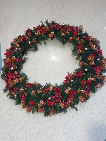 Wreath installed at Outlet City by Christmas decorators Christmas Creatives