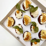 Little Sunshine Cupcakes with pineapple flowers, cape gooseberries and dried orange