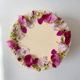 Rhubarb and pistachio cake with rose petals