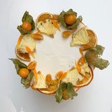 Sunshine cake with pineapple flowers and cape gooseberries