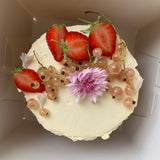 Gooseberry and Elderflower Cake with strawberries, whitecurrants and cornflower
