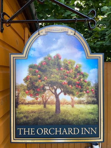 An apple tree bar sign