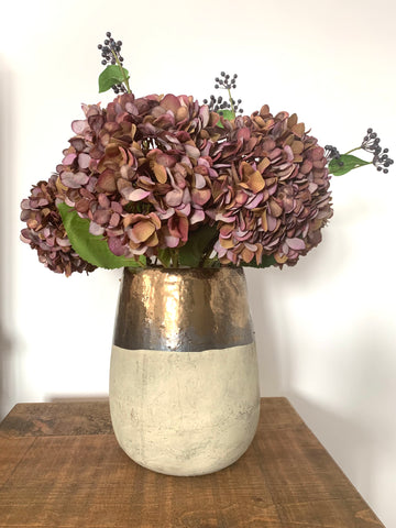 autumnal textured vase cream and gold coloured with dusky pink hydrangeas and autumnal berry stems