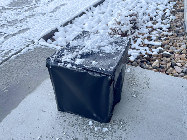 The Sound Dampening Blower Box protecting the air blower from Snow