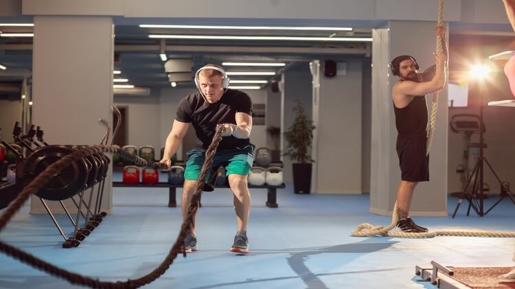 Crossfitter with ropes
