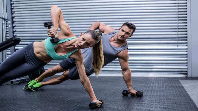 Couple doind the side plank